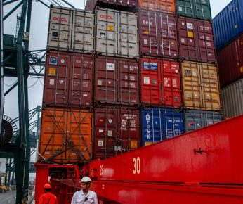 Maritime Logistics Loading Supplies on a Ship Fre