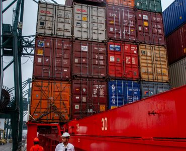 Maritime Logistics Loading Supplies on a Ship Fre