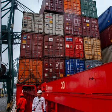 Maritime Logistics Loading Supplies on a Ship Fre